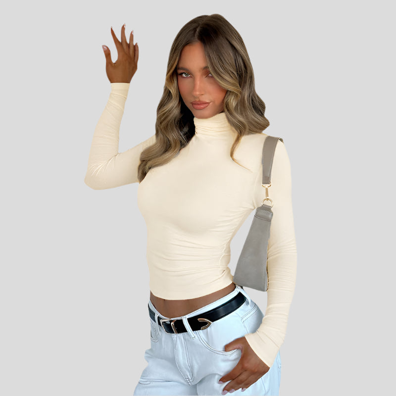 Slim fit rullekravetop med flæsedetaljer – Elegant stretchbomuldsbluse til kvinder