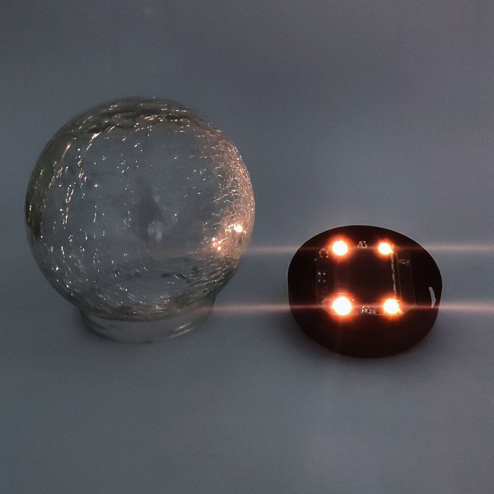 GlowGlobe - Solar knitrende glaslys med jordstag